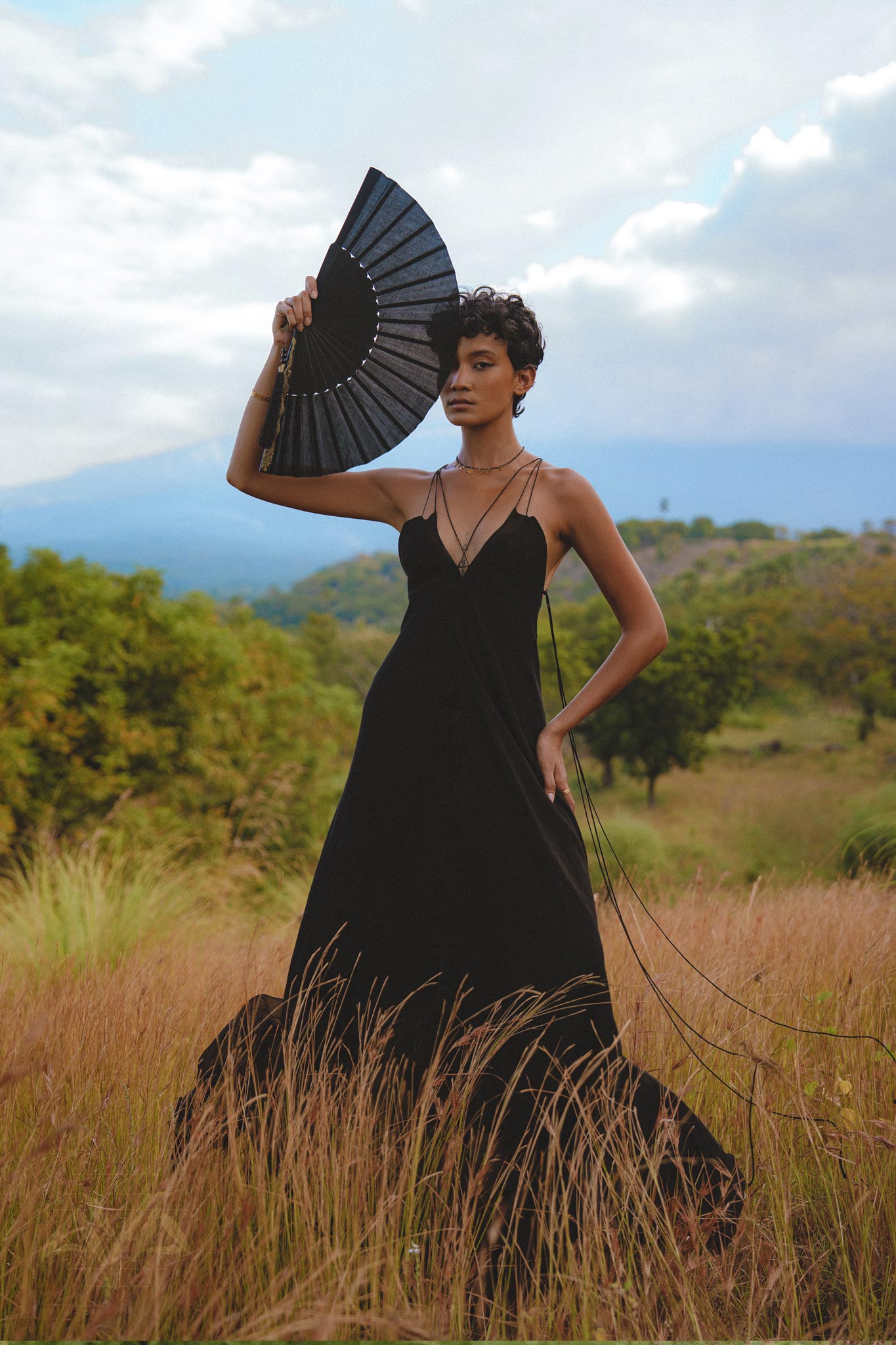 Embrace your inner goddess with this black boho dress, featuring a backless and minimalist design. Handcrafted with intricate lace details.