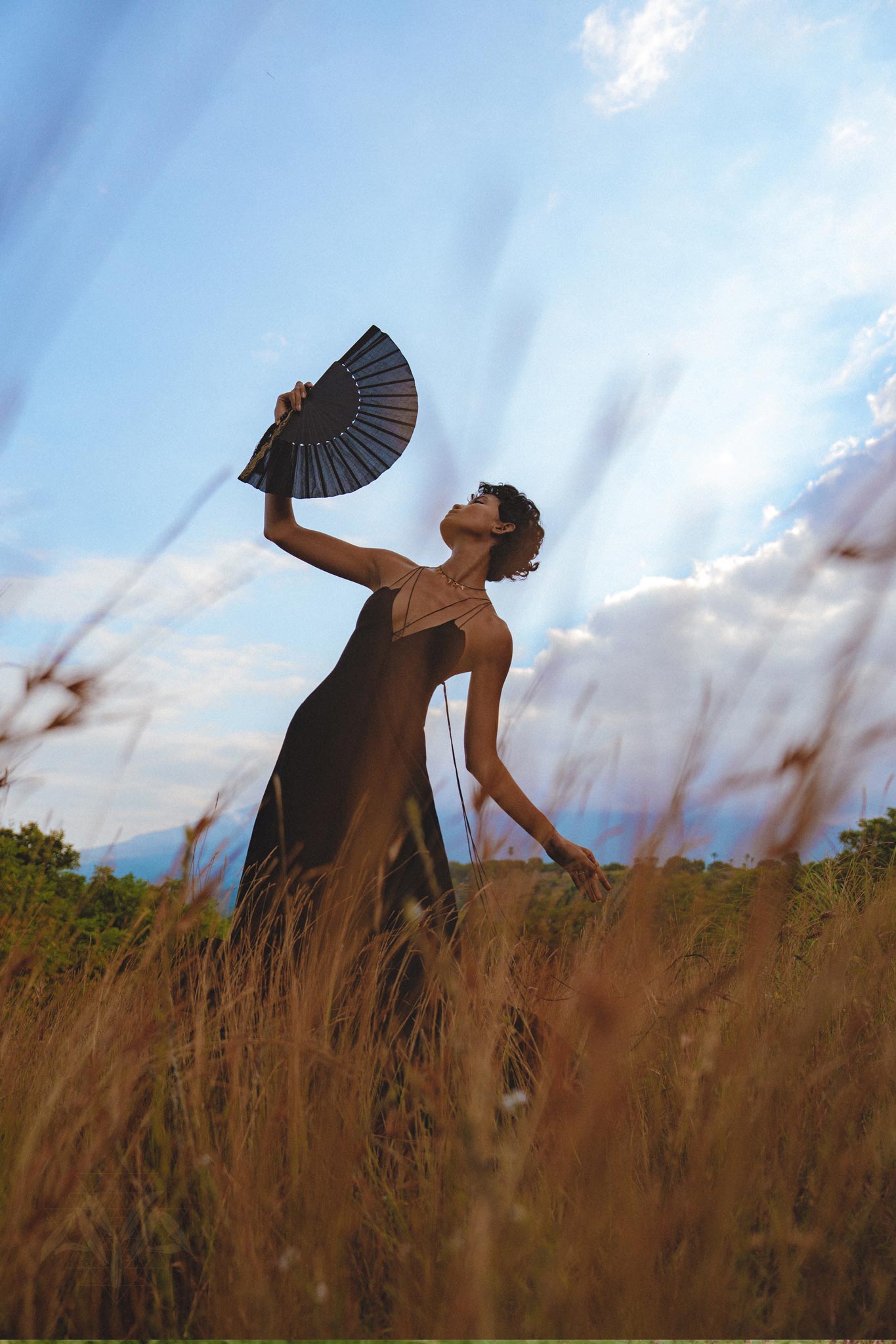 Elevate your summer wardrobe with this bohemian black cocktail dress. The backless and minimalist design, along with intricate lacework, creates a truly unique look.