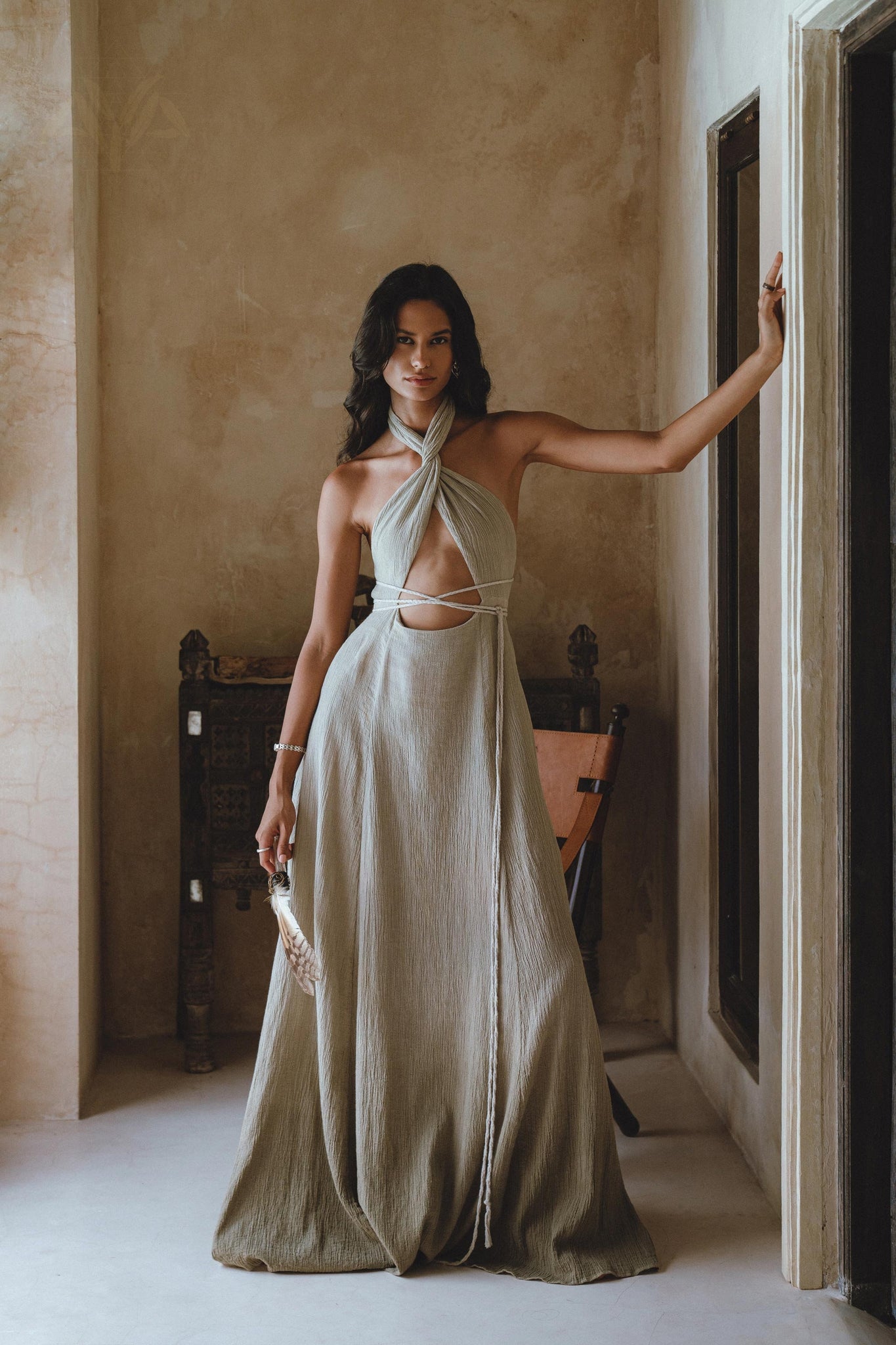 Bohemian-inspired green guest dress, adjustable on the upper part, featuring a natural dye process for distinct shades