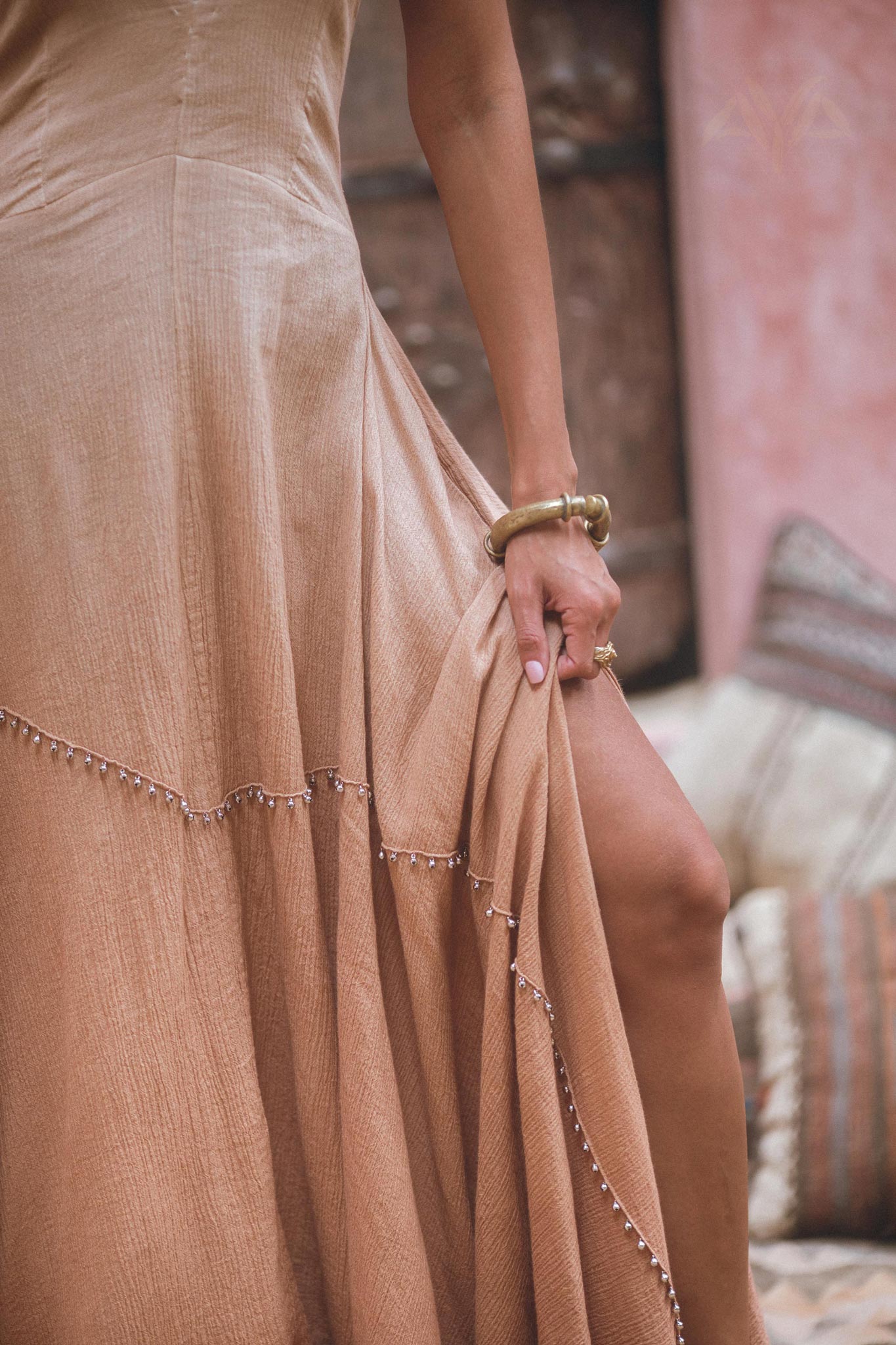 Make a statement with this goddess dress featuring an open neckline, luxurious hand embroidery, and an elegant ombre effect.