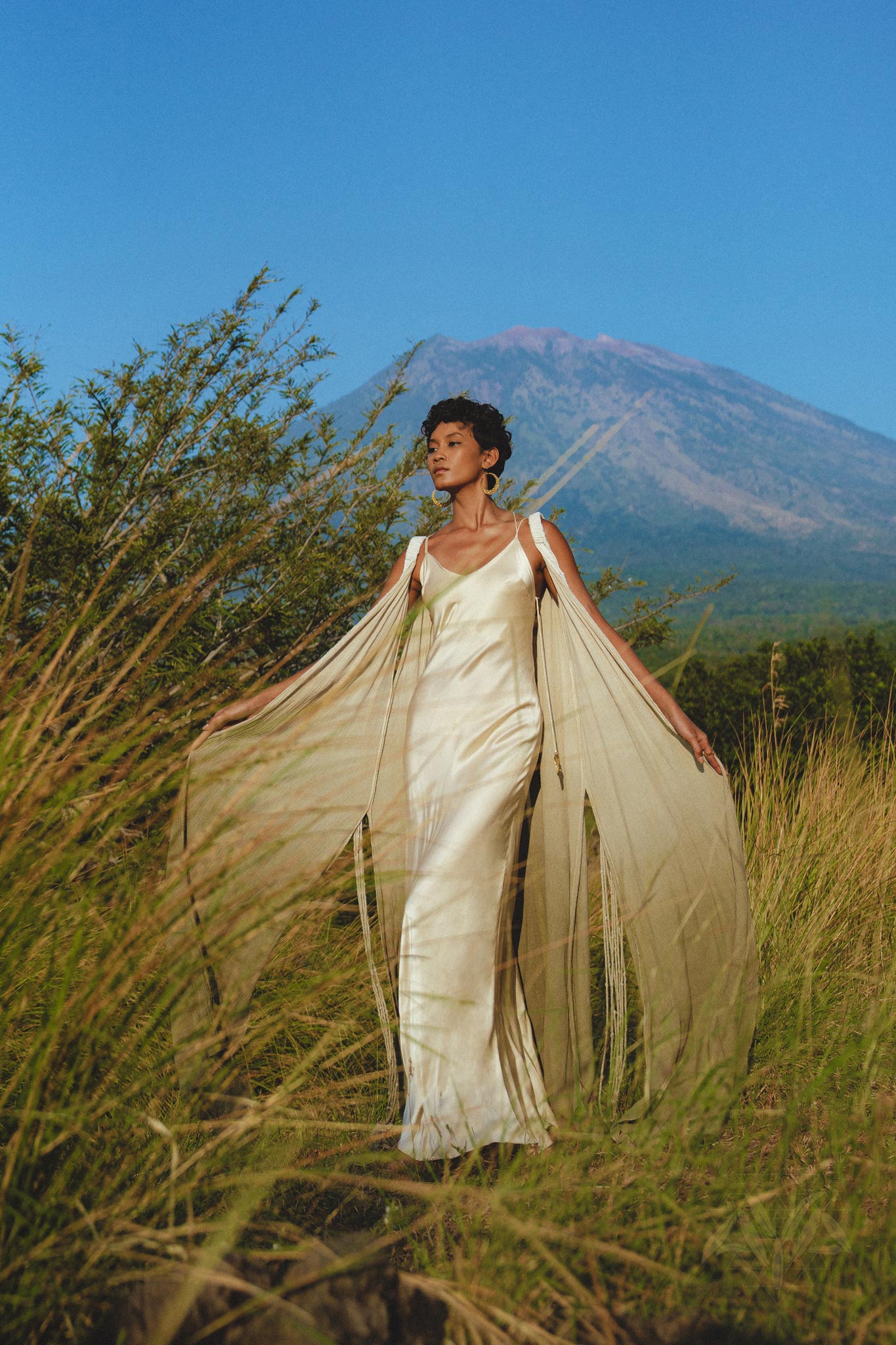 Stunning slip-style wedding dress in off-white, perfect for a minimalist bride.