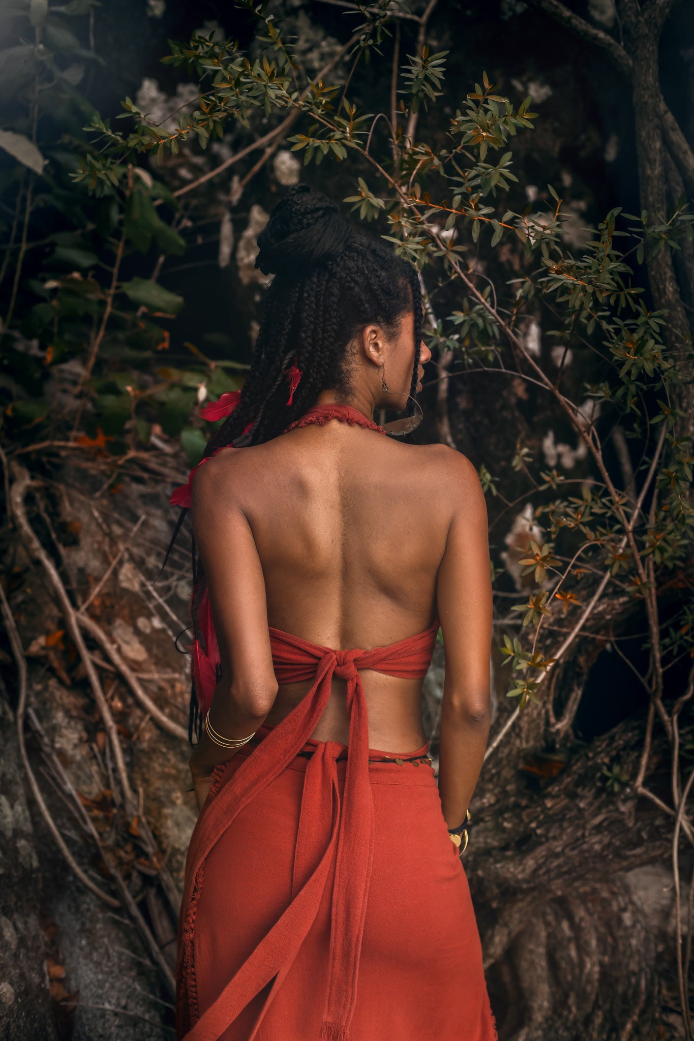 Turn heads in this eye-catching open backred Bohemian crop top!