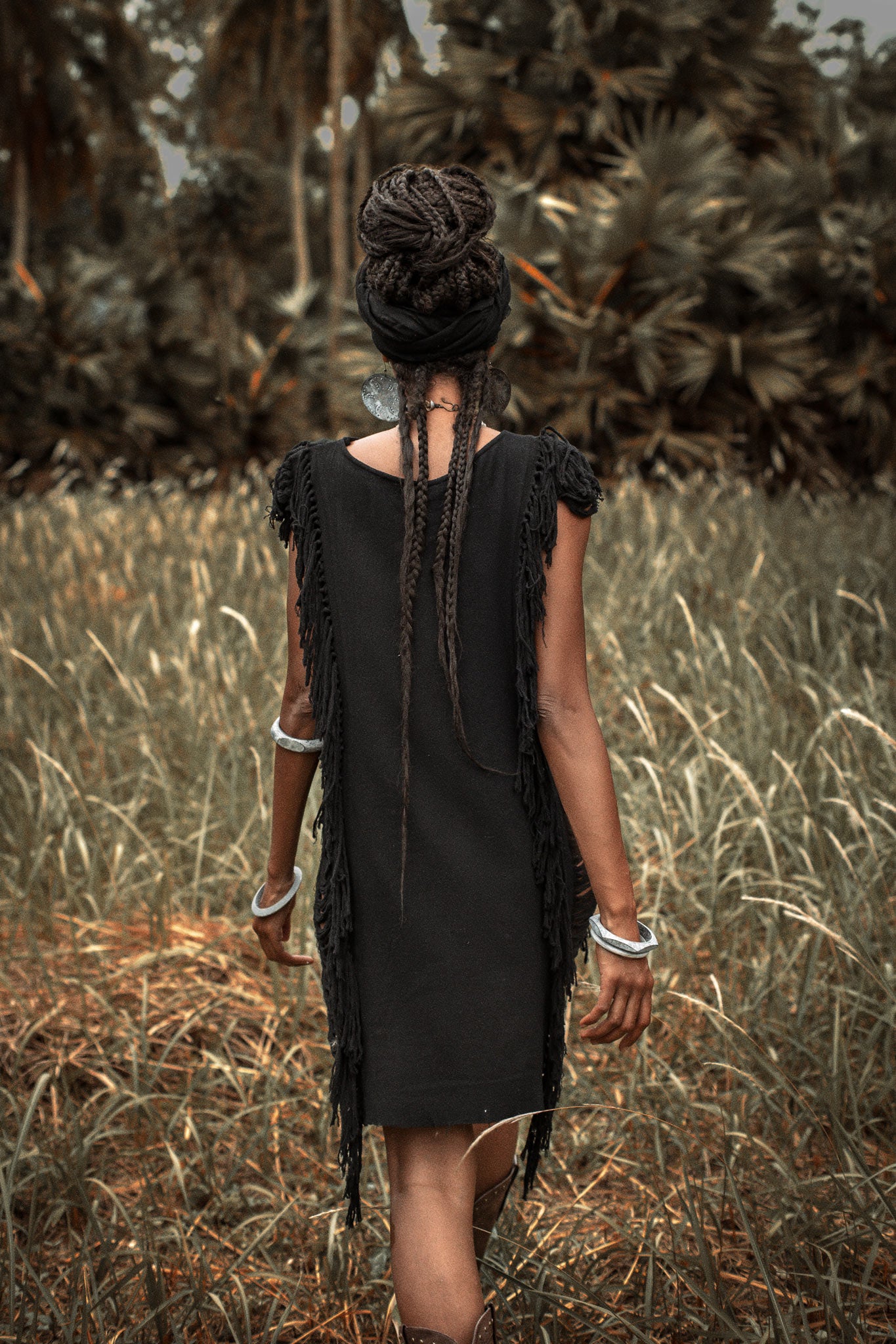 This black mini dress is a must-have for your summer wardrobe with its open sides and ladders.