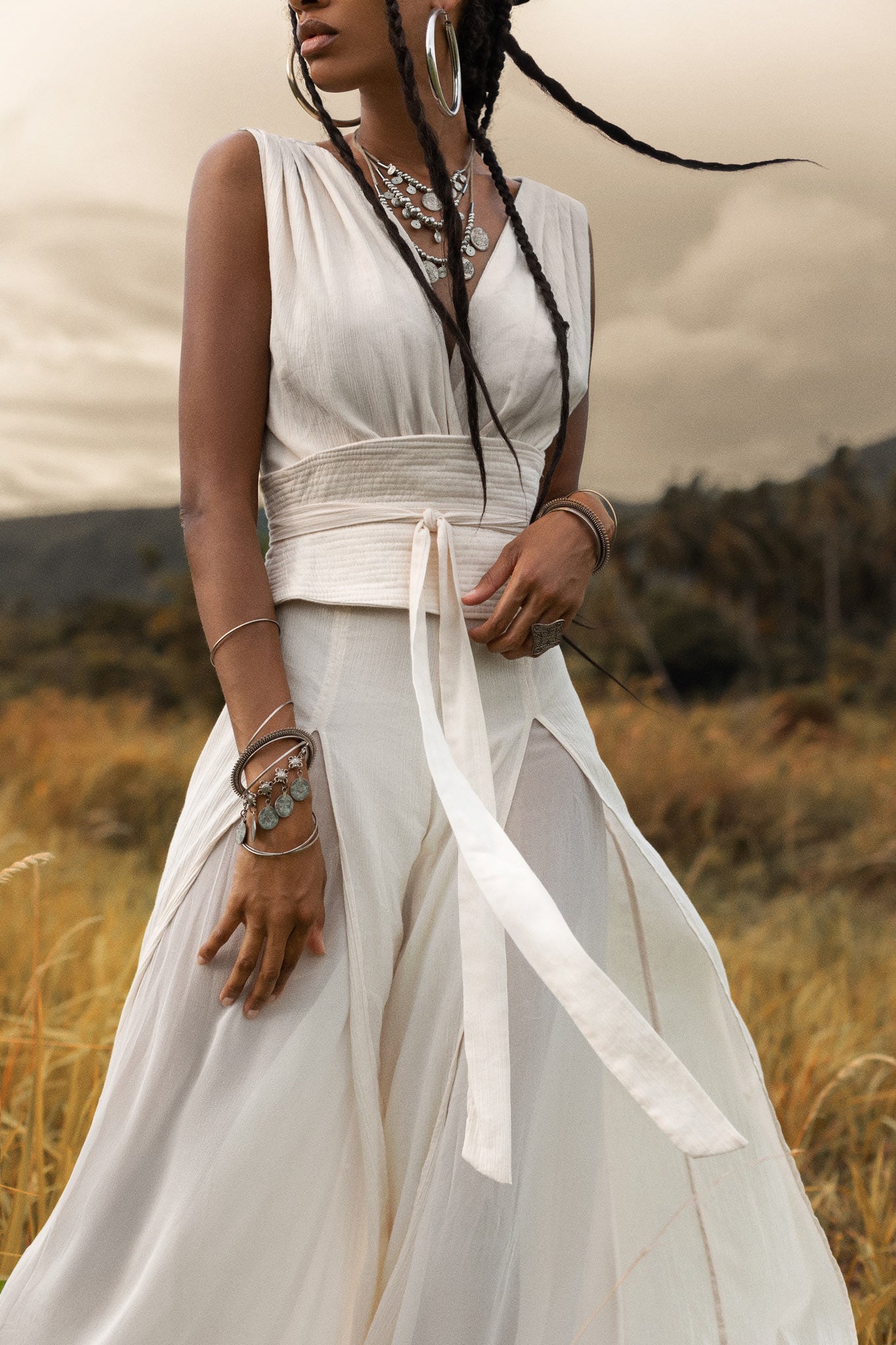 An Off White boho jumpsuit for women that is sure to turn heads, made with the finest silk and cotton.