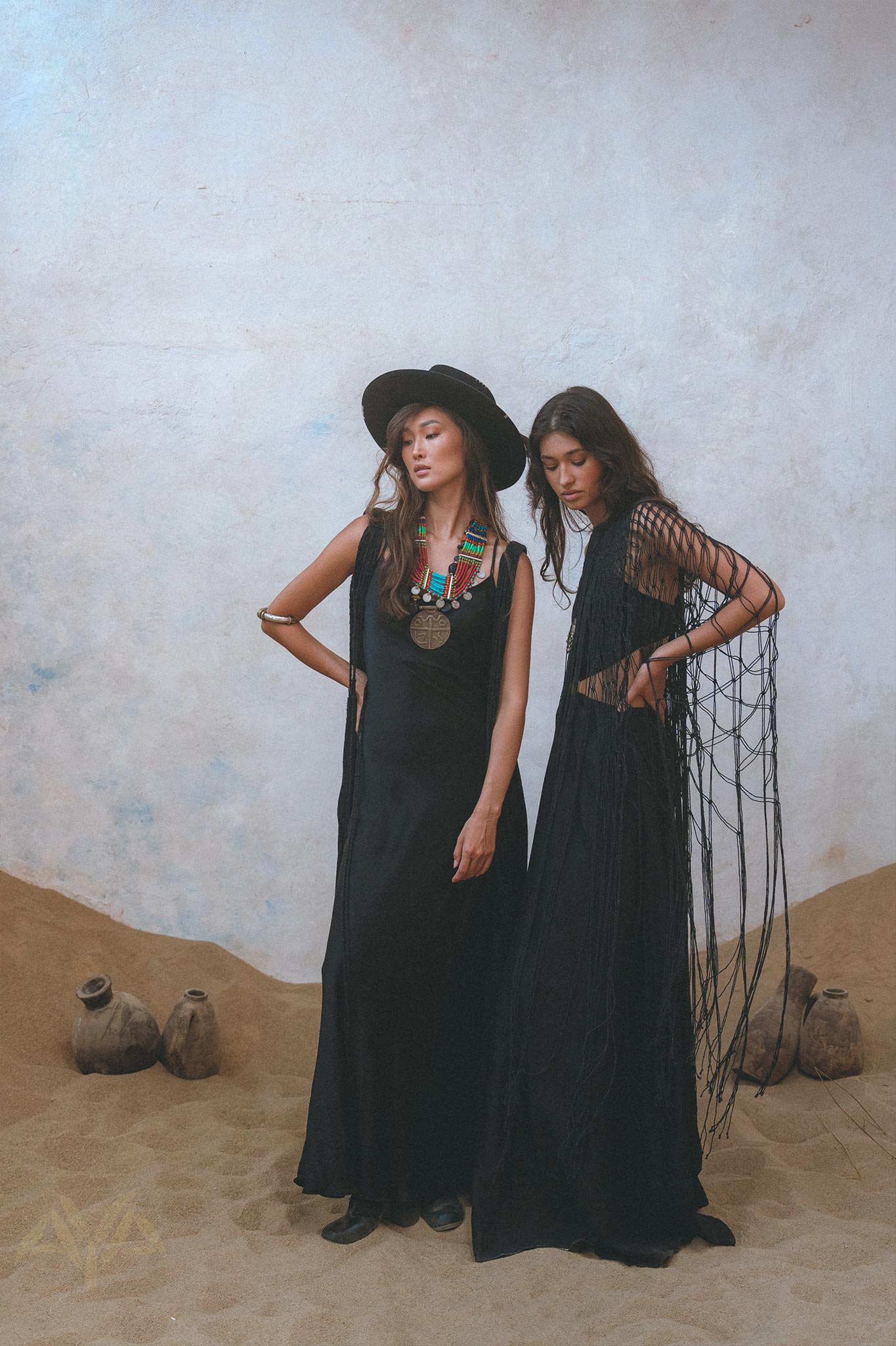 Look effortlessly stylish in the black Summer Net Cover Up from Aya Sacred Wear.