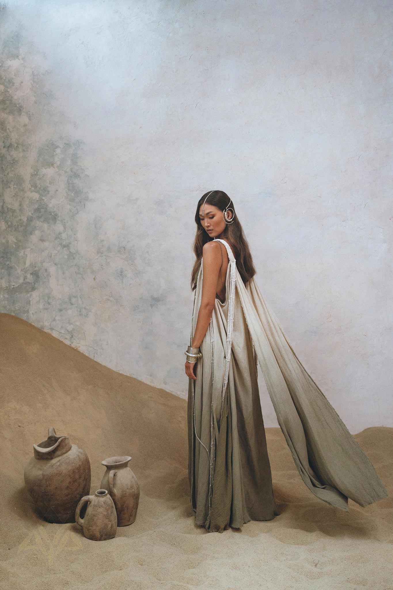 Make a fashion statement with this elegant Sage Green Macrame Cape by Aya Sacred Wear.