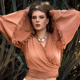 Ochre Pale Orange Boho Top This top is a beautiful ochre color with pale orange accents. It's a great boho style top with wide sleeves and decorated with hand knots.