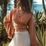 Ochre Pale Orange Boho Top this top is a beautiful ochre color with pale orange accents. It's a great boho style top with wide sleeves and decorated with hand knots. This top would look great with any outfit!