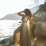 A dark green dress with a flowing silhouette, inspired by Greek goddesses