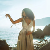 A versatile green dress that can be worn multiple ways.