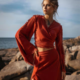 This gorgeous red skirt is perfect for any formal occasion. Pair it with a black top and heels for a stunning look.