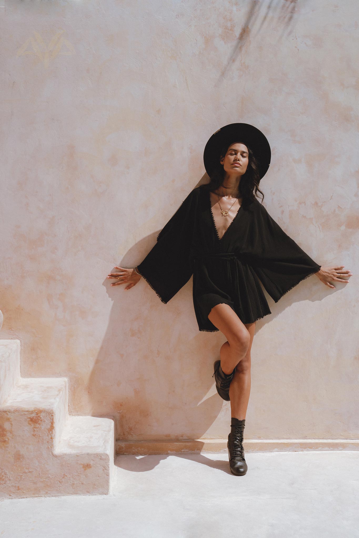 Summer-Ready Black Jumpsuit – Asymmetrical Design with Individual Knots, Elegant Beach Party Attire.