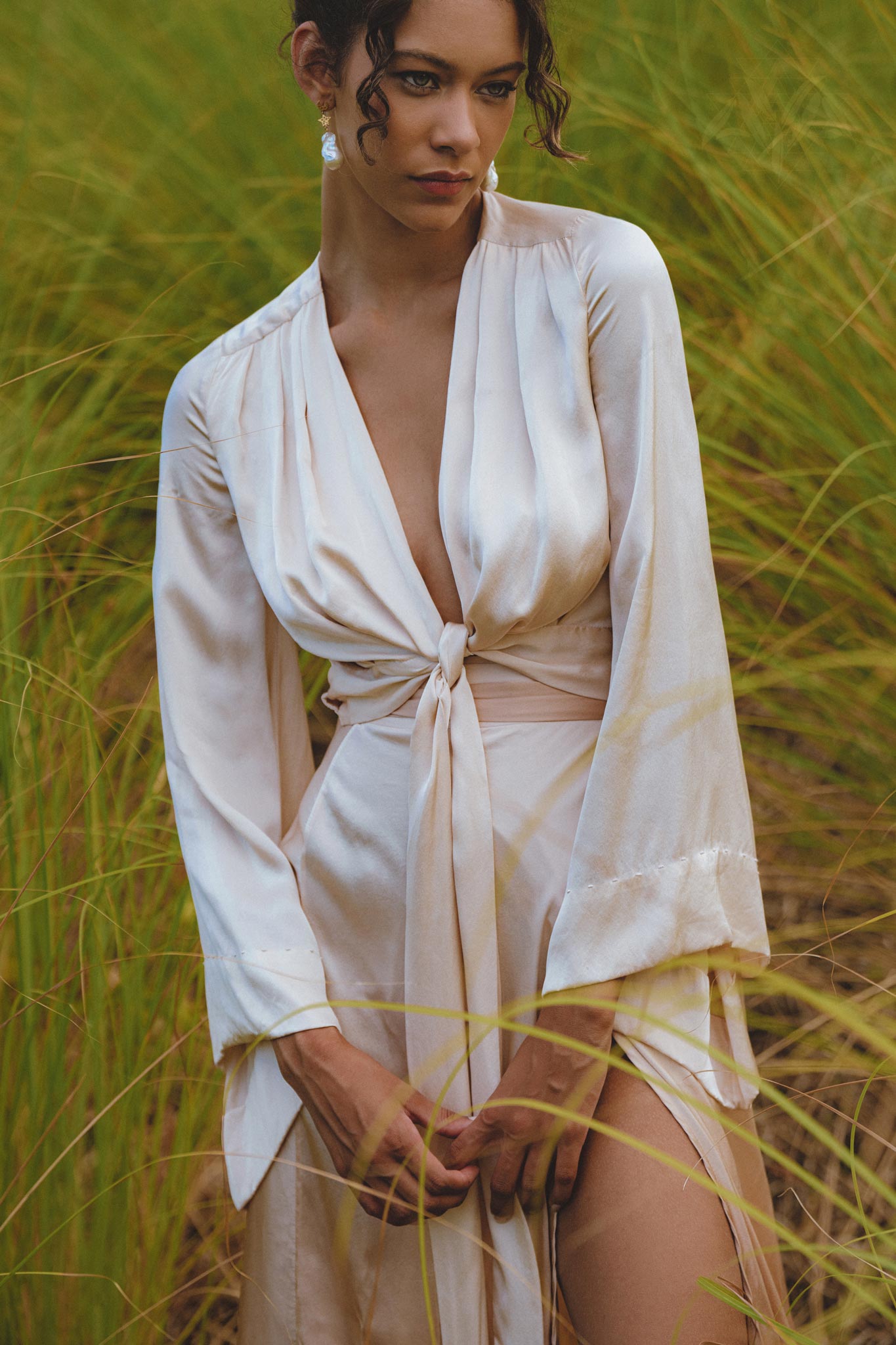 Stylish Powder Pink Venus Peace Silk Skirt, featuring a minimalist wrap design perfect for summer. This organic wrap skirt combines elegance and comfort, ideal for casual outings or special occasions.