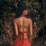 Turn heads in this eye-catching  open backred Bohemian crop top!