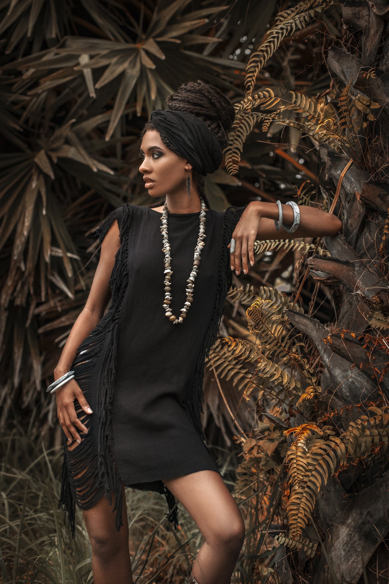 Ladders and open sides make this black mini dress a boho-chic must-have.