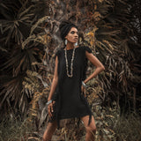 This black mini dress is perfect for a boho-chic look with its open sides and ladders.