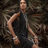 Be summer-ready in this black mini dress with open sides and ladder cut-outs.