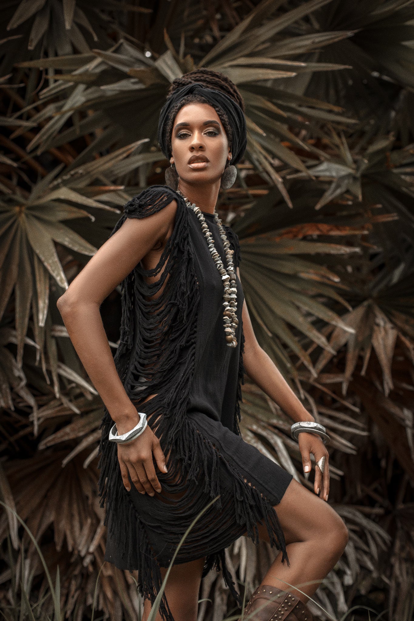 Be summer-ready in this black mini dress with open sides and ladder cut-outs.