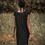 This black mini dress is a must-have for your summer wardrobe with its open sides and ladders.