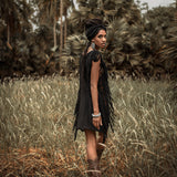 A boho-chic classic, this black mini dress features open sides and ladders.