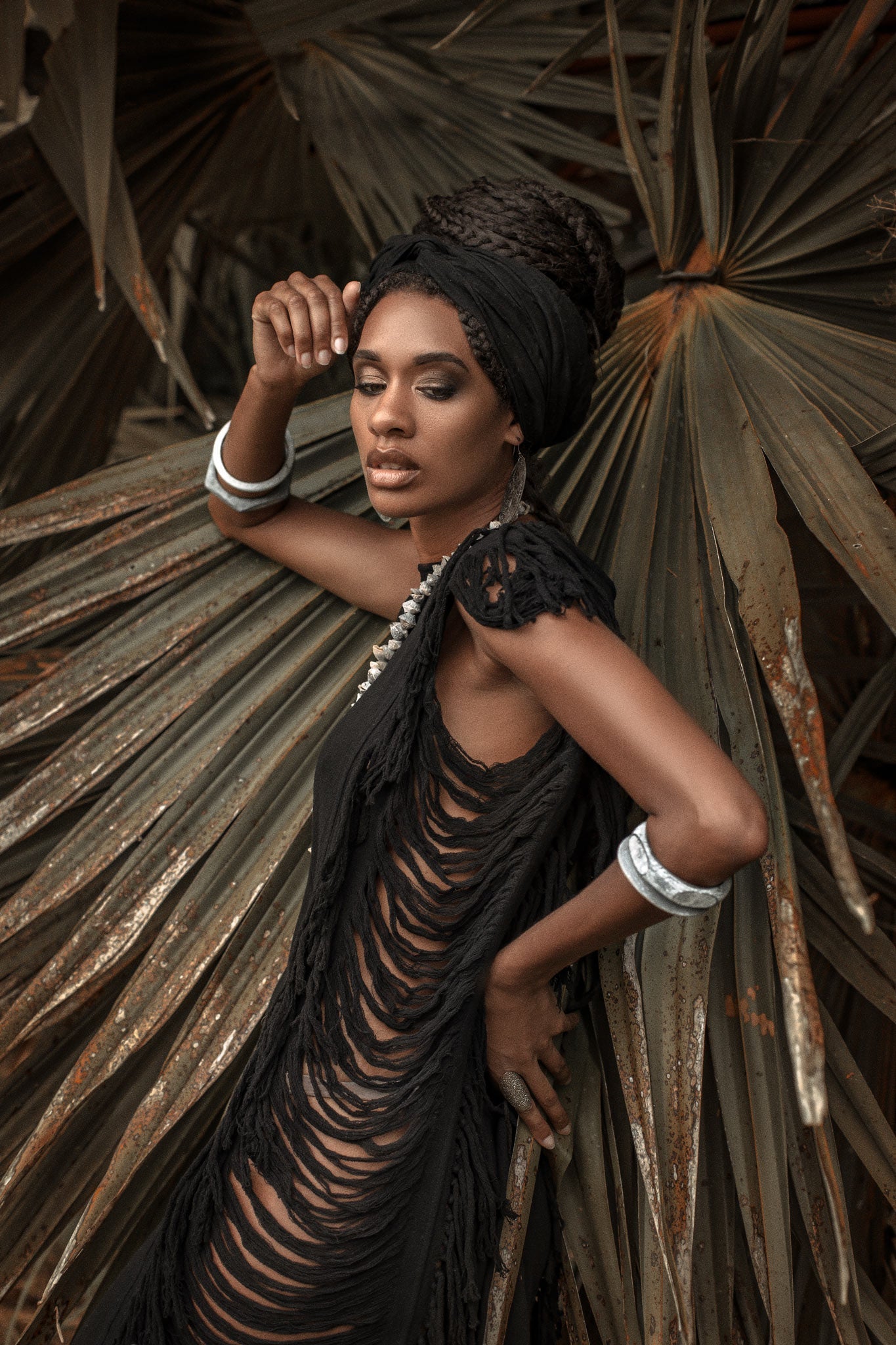 Get the boho look with this ladder-detailed black mini dress.