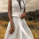 An Off White boho jumpsuit for women that is sure to turn heads, made with the finest silk and cotton.