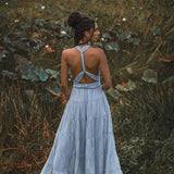 This light blue bohemian dress is perfect for any formal or informal event. The open back and adjustable straps make it both comfortable and stylish.