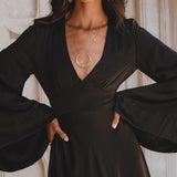 Black Gloss Goddess Dress with Bell Sleeves: A Bohemian maxi dress, ideal for evening events, crafted with ethically sourced Peace Silk.