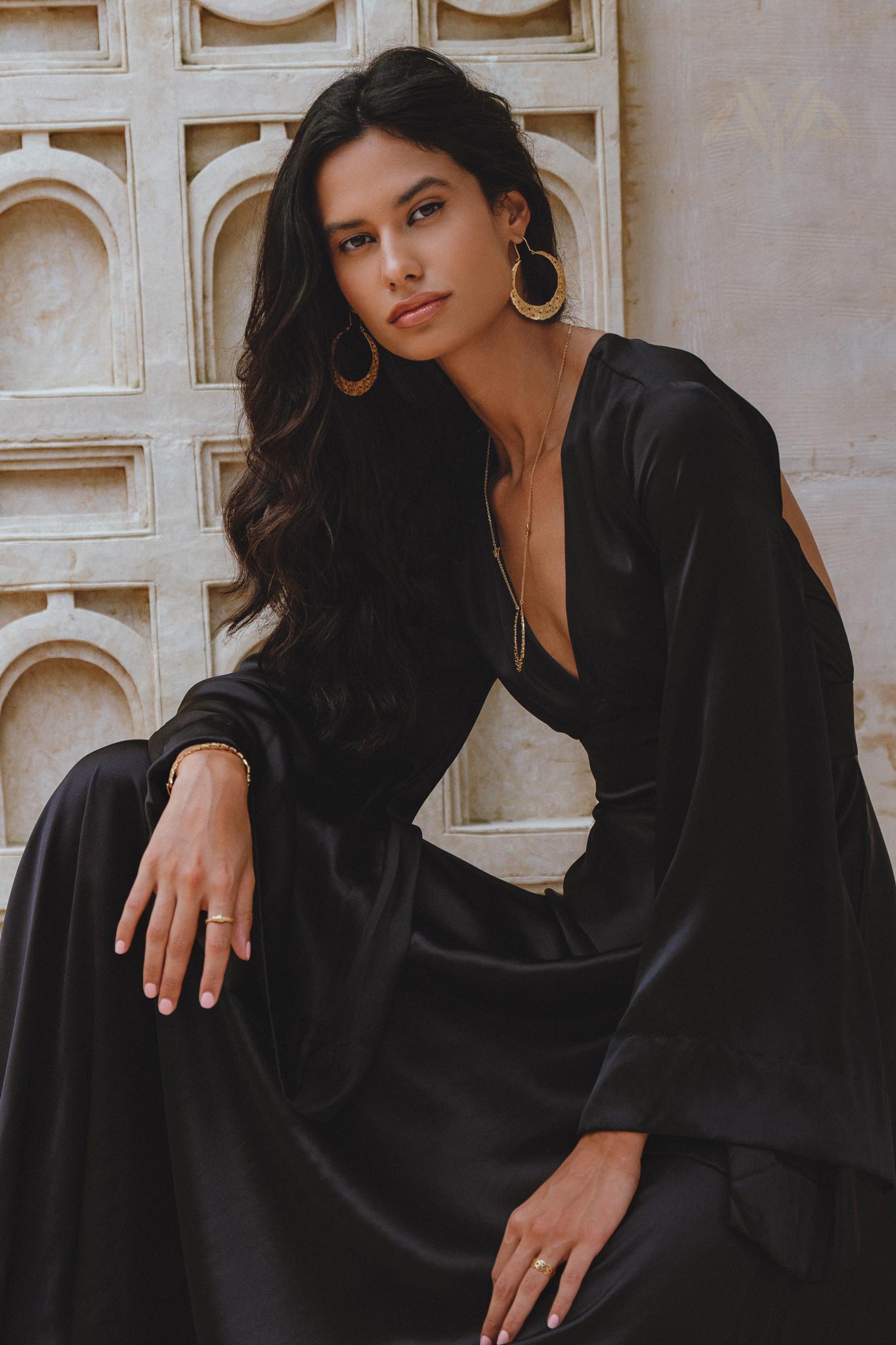 Black Gloss Goddess Dress: A bell sleeve boho dress, exuding grace and sophistication, suitable for weddings and cocktail evenings.