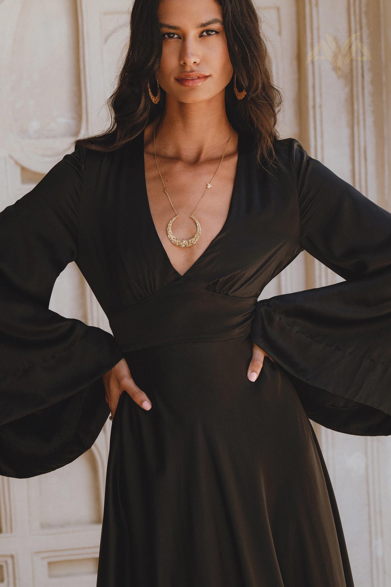 Black Gloss Goddess Dress with Bell Sleeves: A Bohemian maxi dress, ideal for evening events, crafted with ethically sourced Peace Silk.