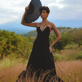 Embrace your inner goddess with this black boho dress, featuring a backless and minimalist design. Handcrafted with intricate lace details.