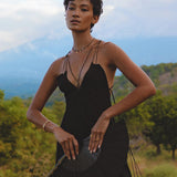 Exude bohemian elegance with this handmade black dress, showcasing delicate lacework. Perfect for a chic and stylish summer look.