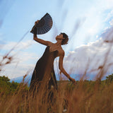 Elevate your summer wardrobe with this bohemian black cocktail dress. The backless and minimalist design, along with intricate lacework, creates a truly unique look.