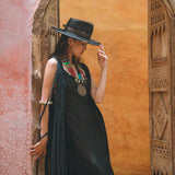 Step into the spotlight with the dramatic black cape dress from Aya Sacred Wear.