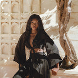 Elegant Black Maxi Skirt: Bohemian Silk Adjustable for Beach Wear - Perfect with Silk Wrap Tops for a Refined Look.