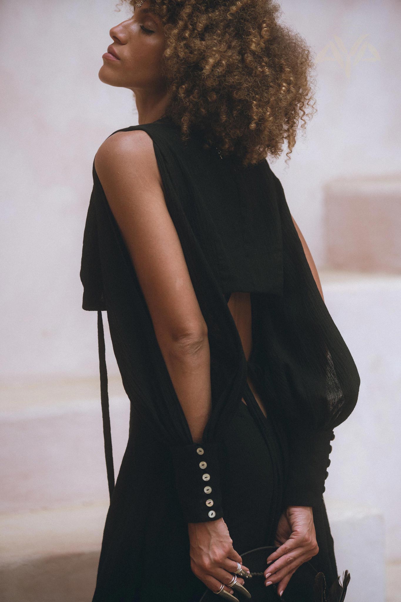 Show off your unique style in Aya Sacred Wear's Black Open Shoulders set.