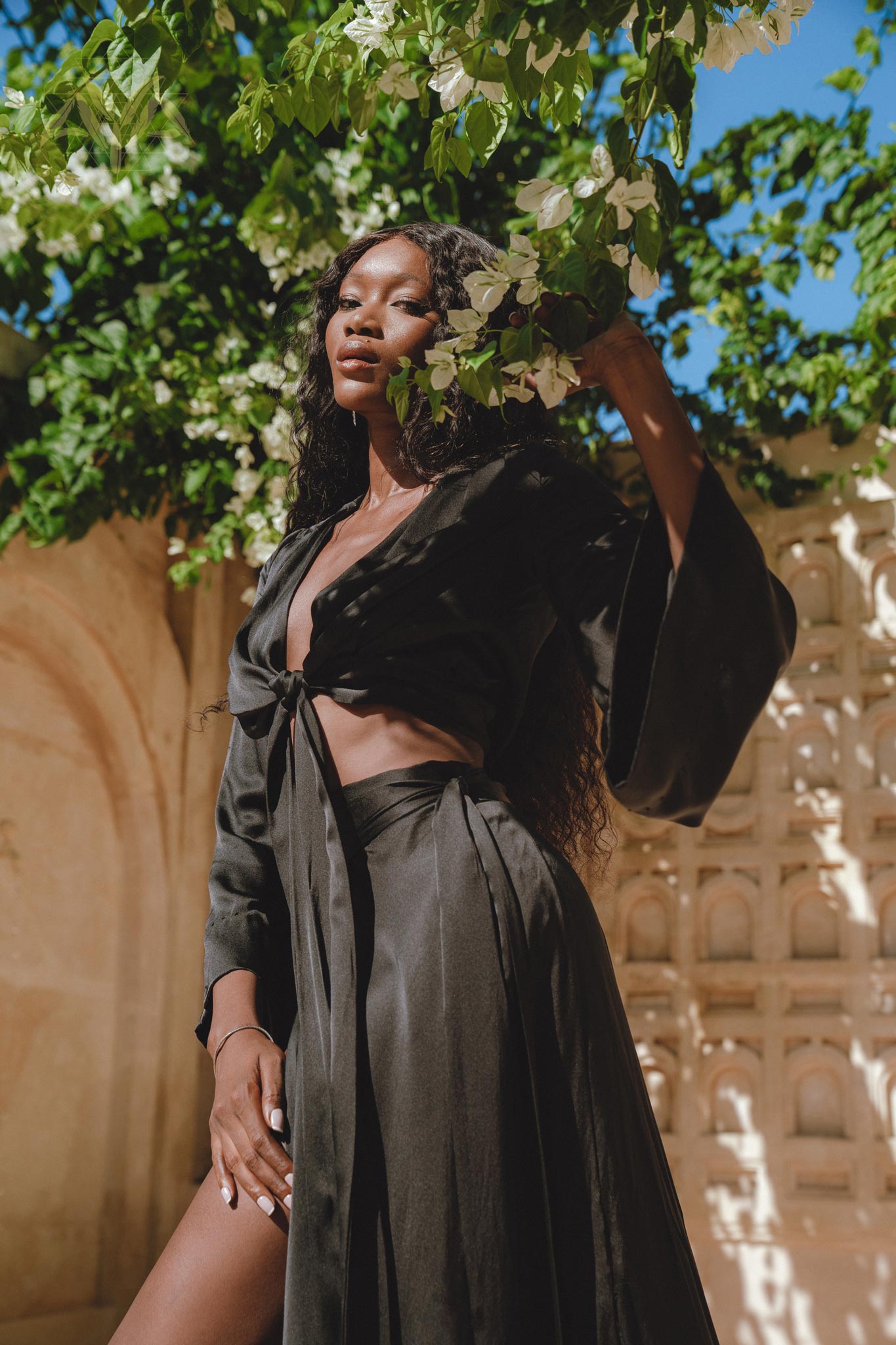 Alluring Black Silk Kimono Crop Top - Elegant Women's Wrap Design with Bell Sleeves, Perfect Addition to a Chic Wardrobe.