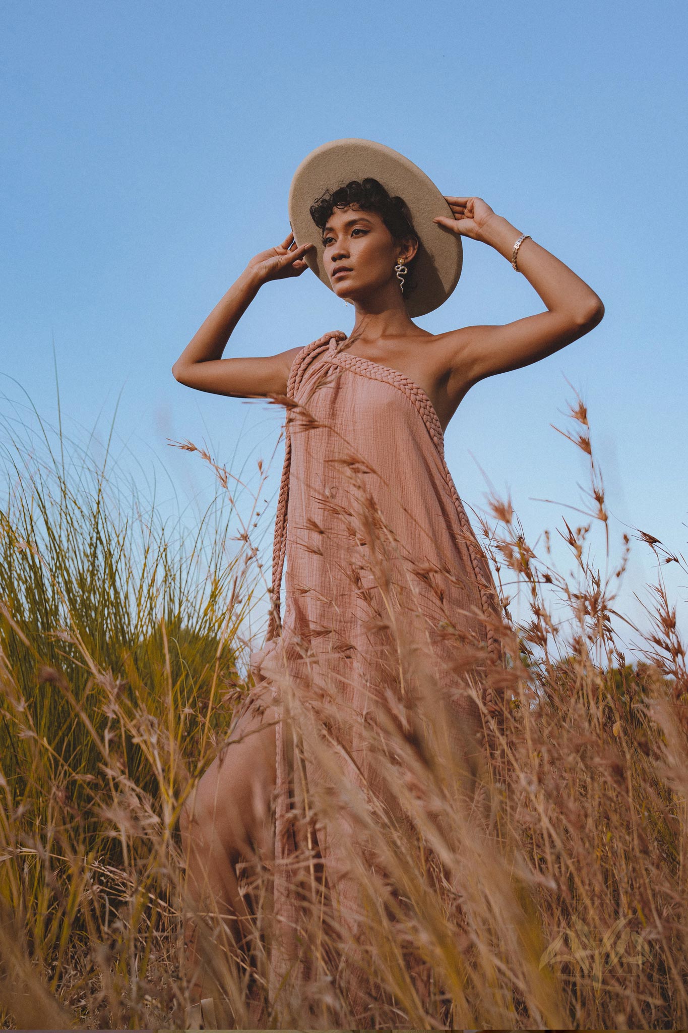 Capture the Spotlight in Aya Sacred Wear's Dusty Pink Toga Dress