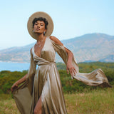 Luxurious silk dress in a light sage hue, perfect for weddings and special occasions. Effortlessly elegant and bohemian-inspired, with mesmerizing bell sleeves.