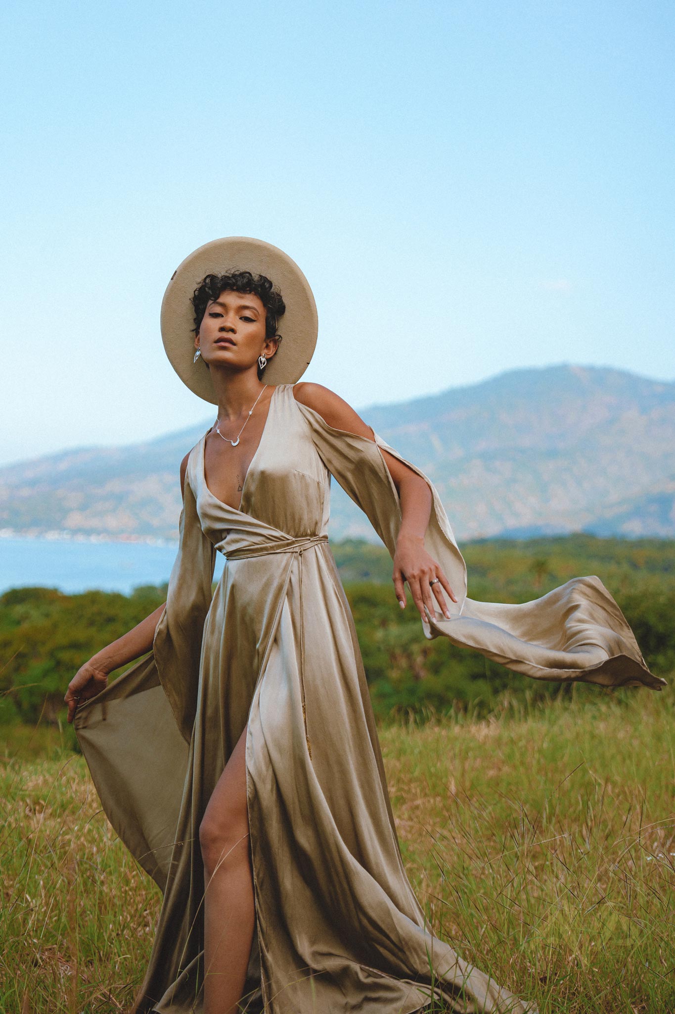 Luxurious silk dress in a light sage hue, perfect for weddings and special occasions. Effortlessly elegant and bohemian-inspired, with mesmerizing bell sleeves.