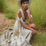 Envelop yourself in timeless beauty with this silk wedding guest dress in light sage. Radiating bohemian elegance, the wrap kimono design and bell sleeves create a truly magical ensemble.