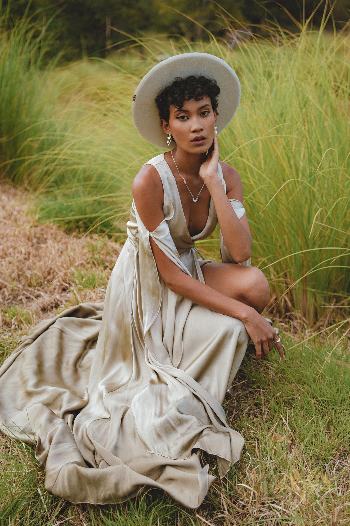 Envelop yourself in timeless beauty with this silk wedding guest dress in light sage. Radiating bohemian elegance, the wrap kimono design and bell sleeves create a truly magical ensemble.