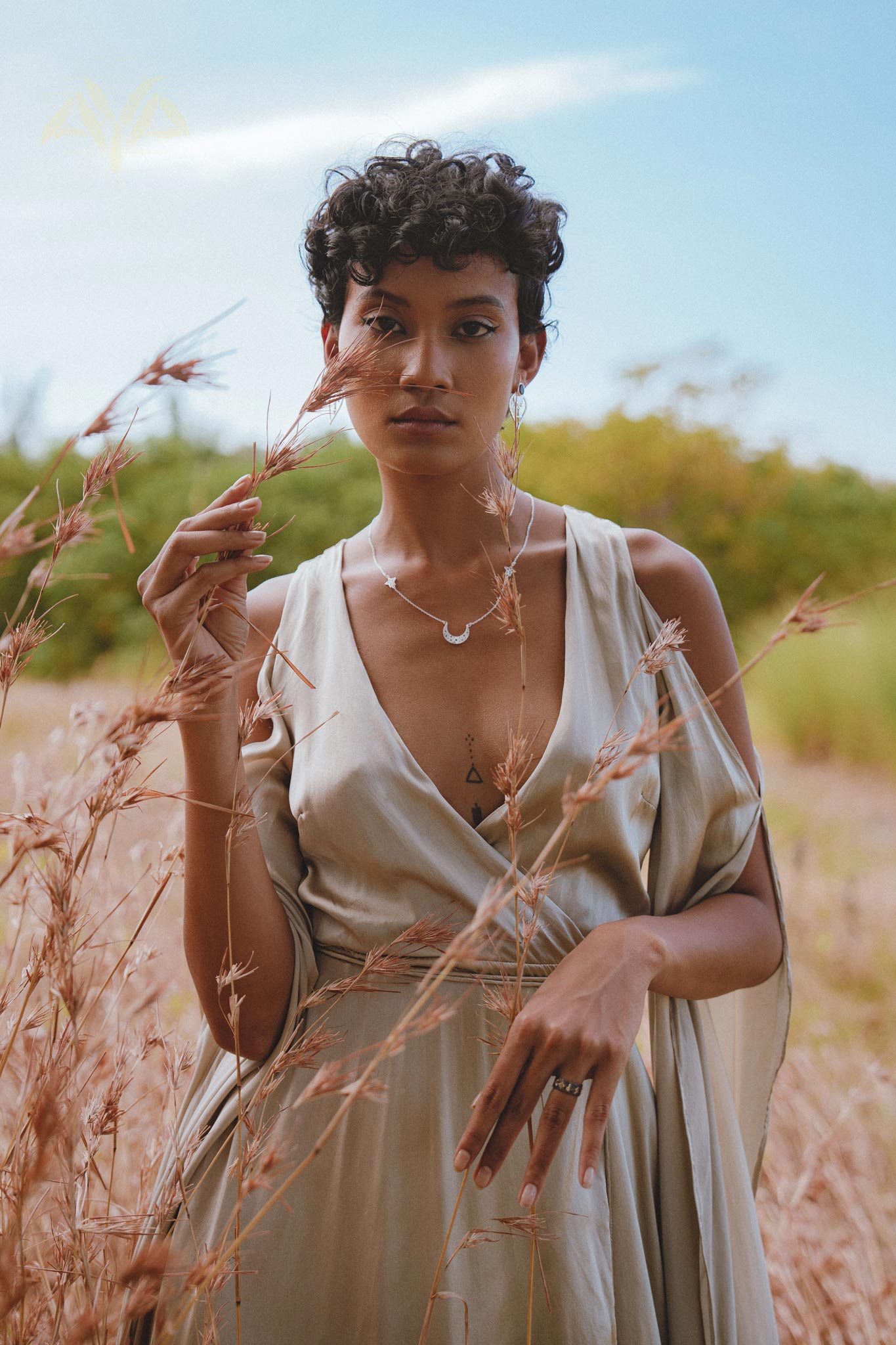 This exquisite silk dress in a soft sage shade is a dreamy choice for bridesmaids or an enchanted wedding guest. The wrap kimono silhouette and flowing bell sleeves create a bohemian yet sophisticated look.