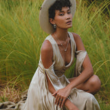 Indulge in the elegance of this light sage silk dress, perfect for both formal occasions and bohemian-inspired events. The wrap kimono style and bell sleeves add a touch of ethereal beauty.