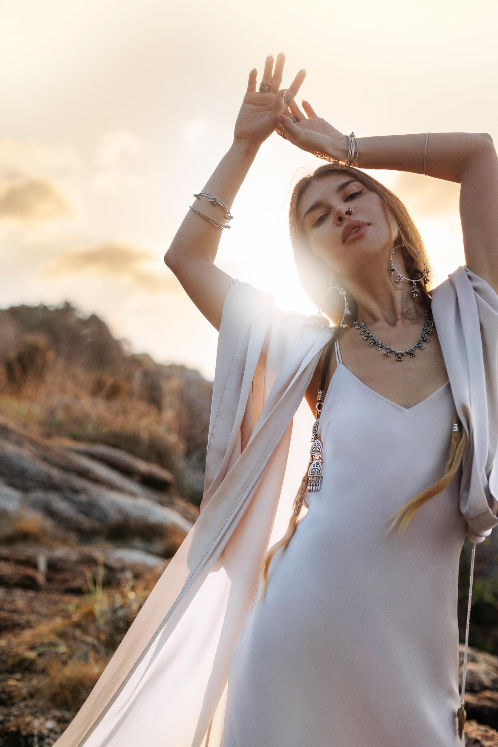 Mist blue peace silk maxi slip dress made from organic Ahimsa silk, soft, breathable, and ethically produced without harming silkworms. This bohemian gown features delicate handmade brass angel wing details and a flowing silhouette that flatters the body. Lightweight and airy, it is perfect for summer, travel, ceremonies, weddings, or everyday luxury wear. Botanically dyed with natural pigments, each dress is unique, sustainable, and designed for comfort, elegance, and timeless feminine style.