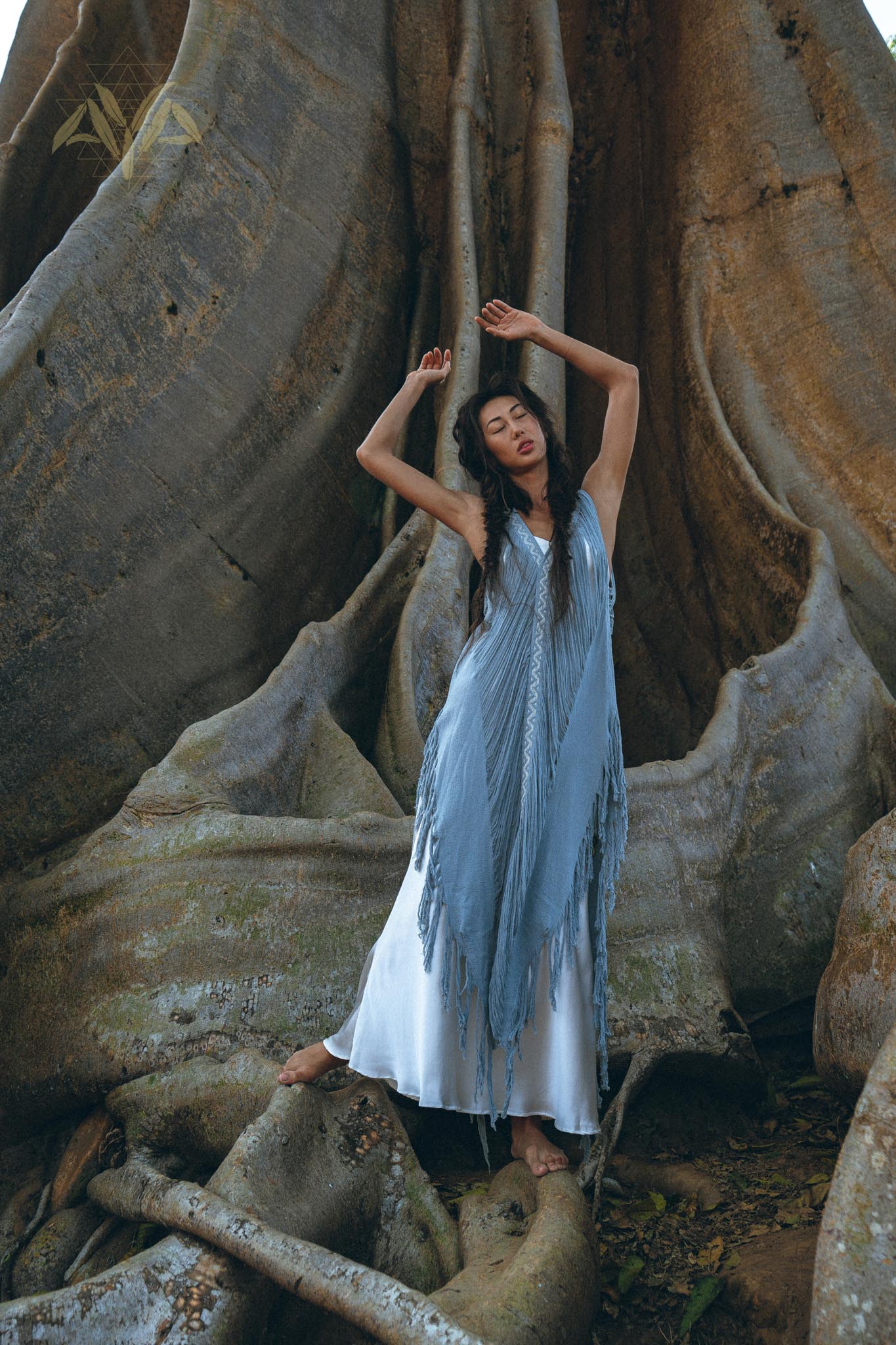 Look effortless and beautiful in this "Threads of Life" dress with its stunning deep blue hand-loomed layover and handmade embroidery.