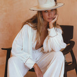 Versatile Adjustable Pants - These off white wide boot trousers can be dressed up or down for any occasion