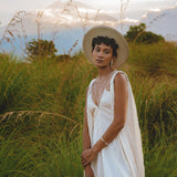 Be the envy of all the gods in the Off-White Greek Goddess Cape Dress from Aya Sacred Wear.