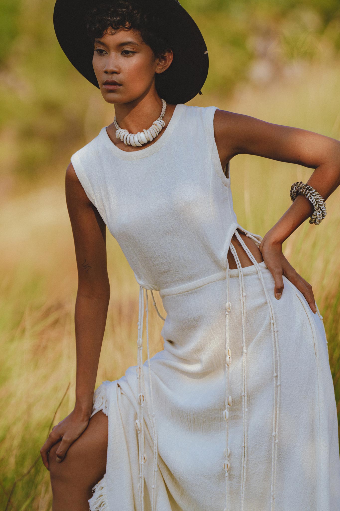 Make a summer statement in Aya Sacred Wear's Off White Macrame Dress