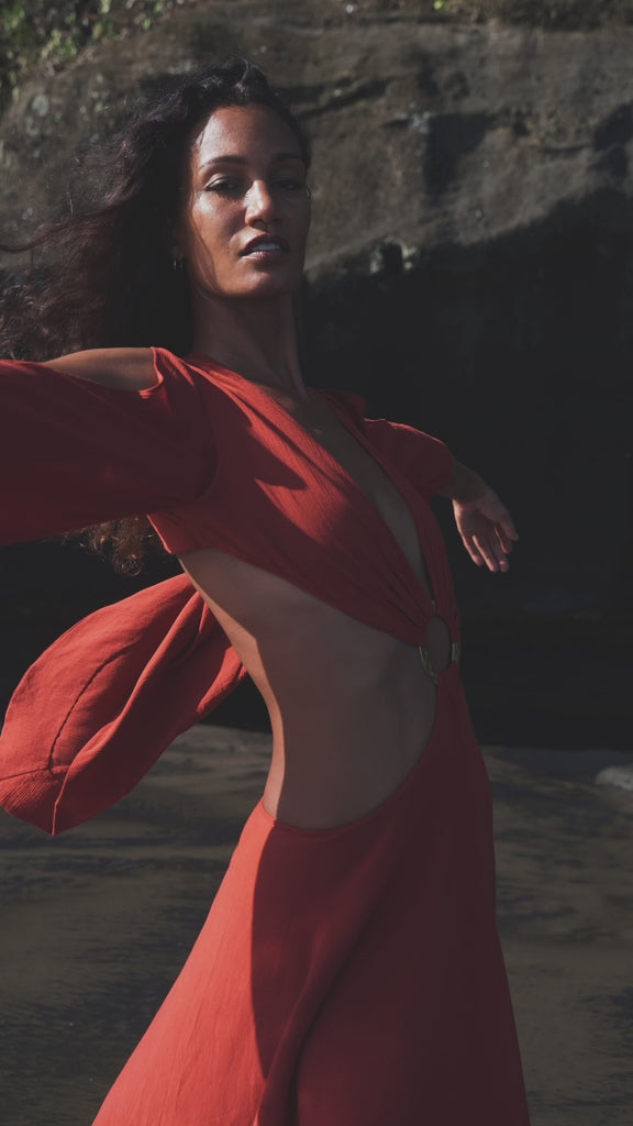 Stand out from the crowd in this exquisite wine red boho dress with bell sleeves & copper rings.